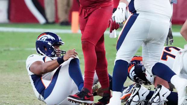 Arizona Cardinals linebacker Jesse Luketa (43) reacts after sacking Denver Broncos quarterback Russell Wilson (3) during a preseason game at State Farm Stadium in Glendale on Aug. 11, 2023